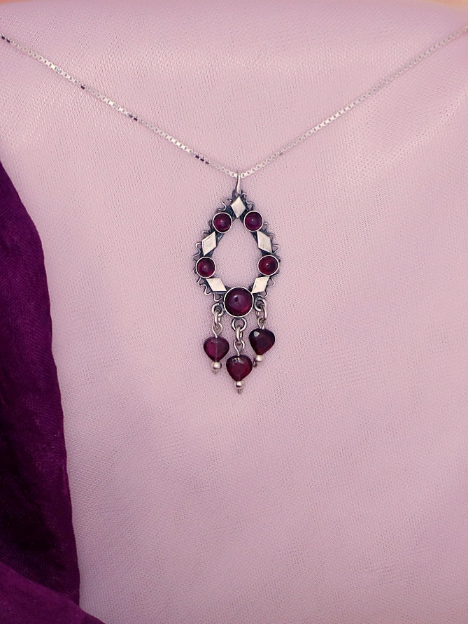 B299- Silver Pendant with Garnet Stones