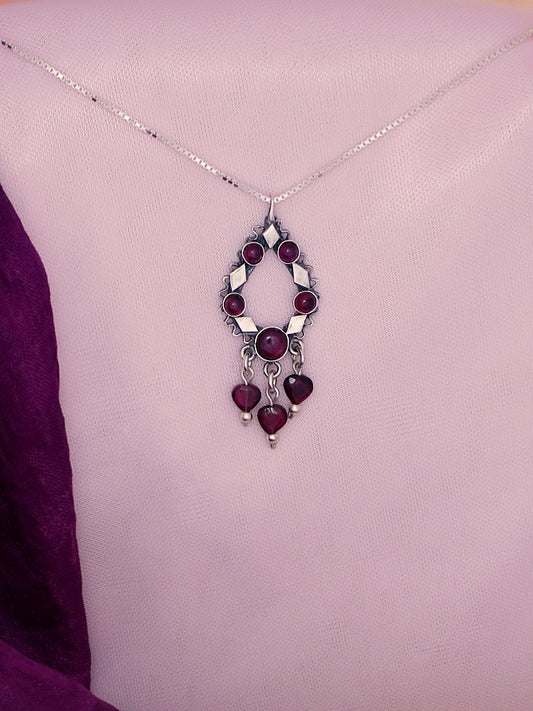 B299- Silver Pendant with Garnet Stones